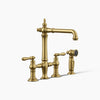 Kohler Three-hole bridge kitchen sink faucet with side sprayer