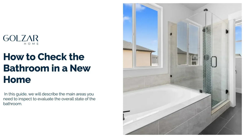 A bright, modern bathroom has a white built-in tub next to a glass-enclosed shower with blue and white patterned tiles. A large window provides a view of a neighborhood.