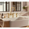 Kohler Two-hole bridge kitchen sink faucet with side sprayer