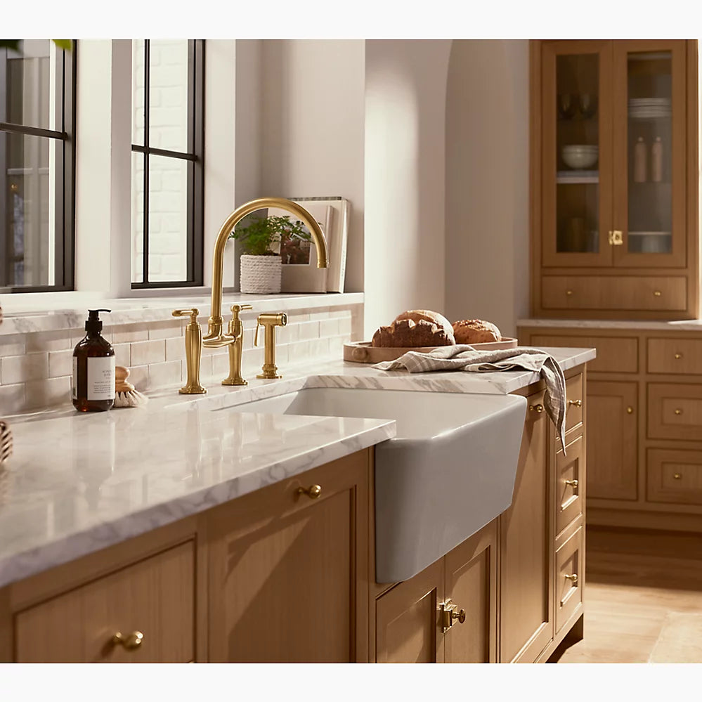 Kohler Two-hole bridge kitchen sink faucet with side sprayer