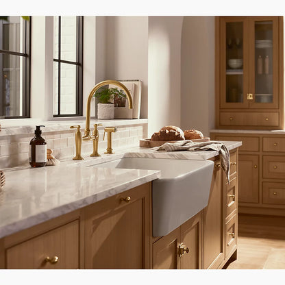 Kohler Two-hole bridge kitchen sink faucet with side sprayer