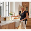 Kohler Two-hole bridge kitchen sink faucet with side sprayer