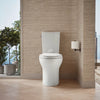 Kohler Two-piece elongated toilet with skirted trapway, dual-flush