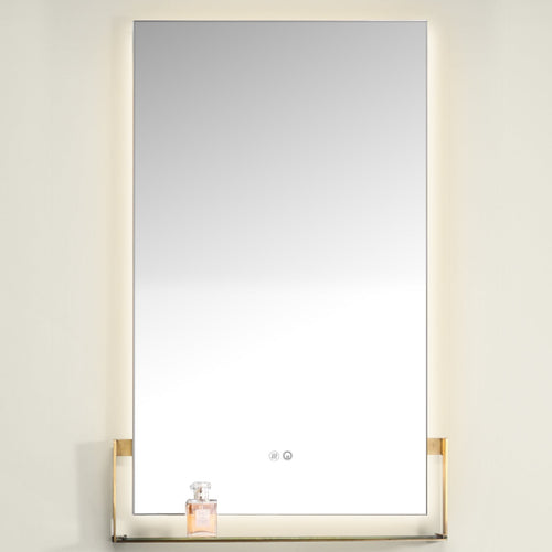 Rectangular mirror with gold frame on a white wall