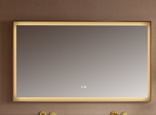 Rectangular mirror with gold frame on a beige wall