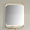 Rectangular mirror with gold frame on a beige wall