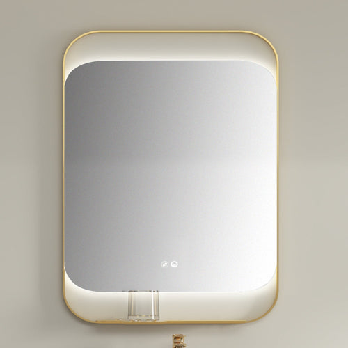 Rectangular mirror with gold frame on a beige wall