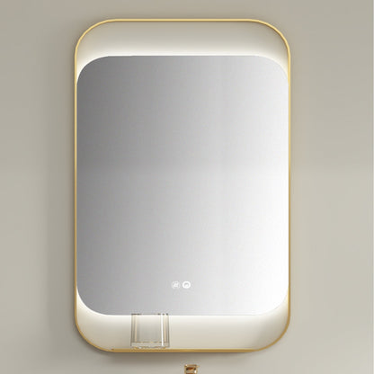 Rectangular mirror with gold frame on a light gray wall