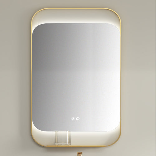 Rectangular mirror with gold frame on a light gray wall
