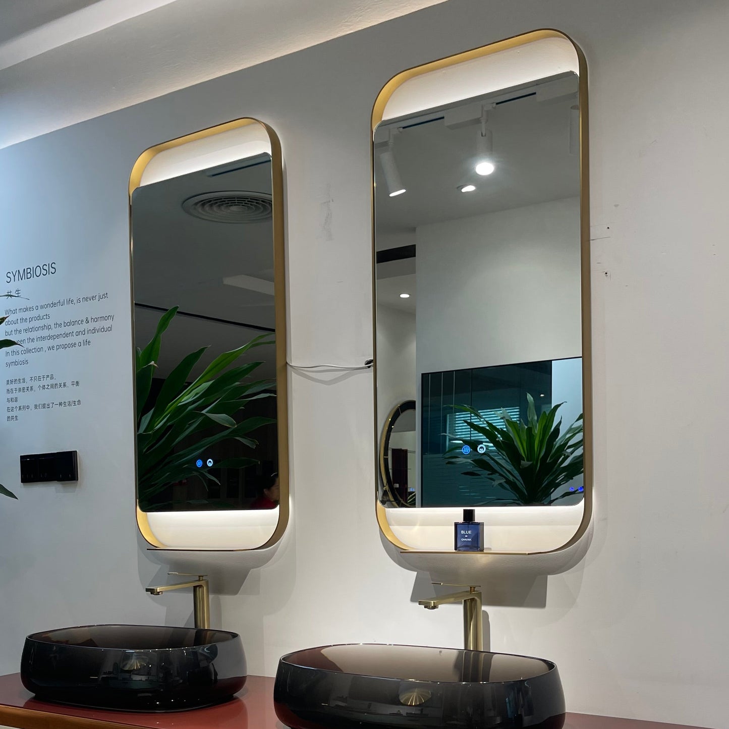 Modern vanity with two mirrors on a white wall