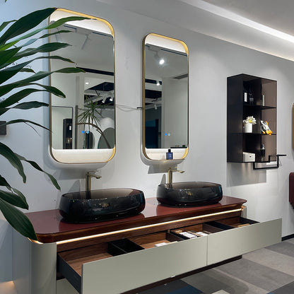 Bathroom vanity with two mirrors, sinks, and a shelf.