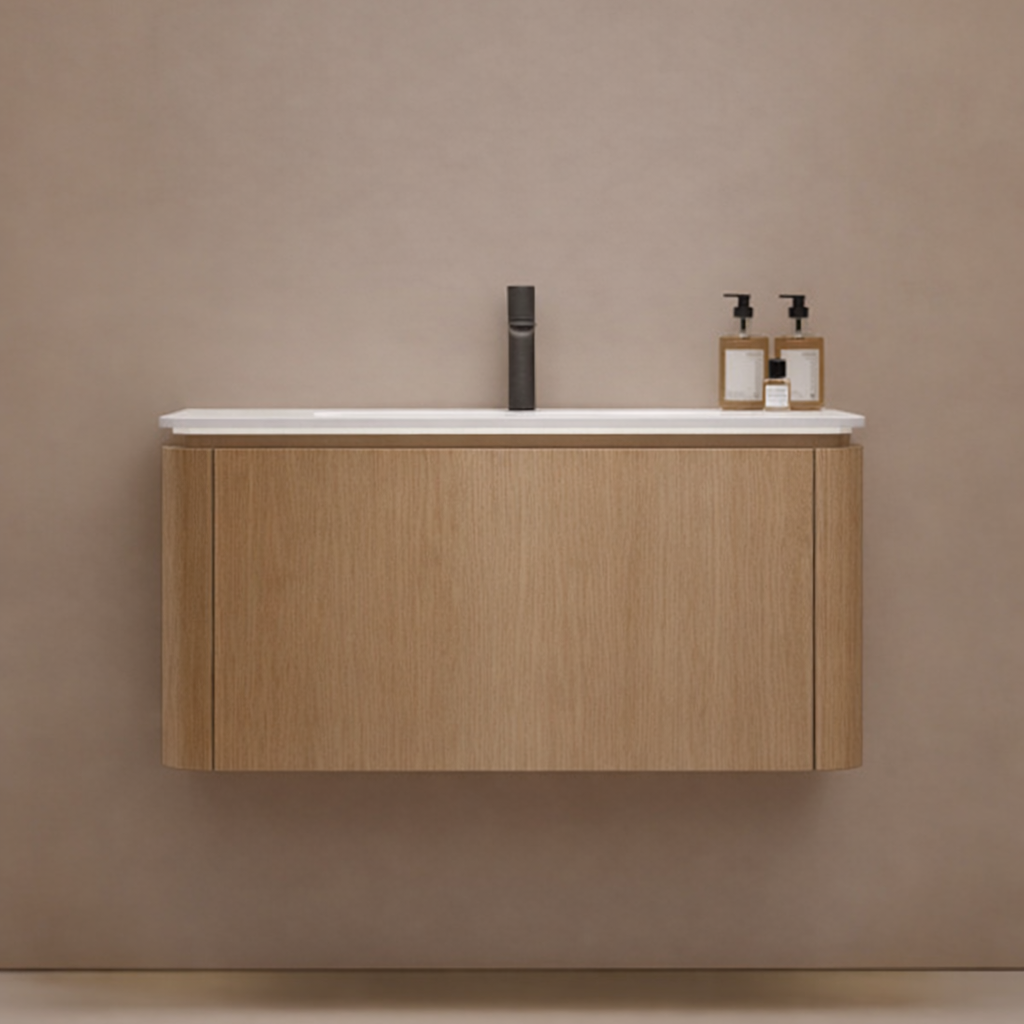 Bathroom vanity with wooden cabinet and white countertop against a beige wall.