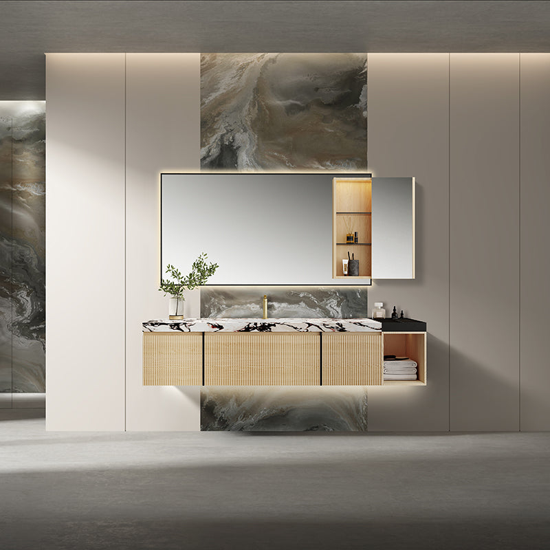 GODI floating vanity with warm wood finish and a marble feature wall