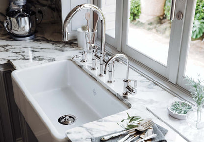 Perrin & Rowe Armstrong bridge kitchen faucet, filter faucet and soap dispenser in a Polished Chrome kitchen setting