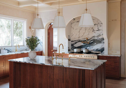 Perrin & Rowe Georgian Era bridge kitchen faucet, pot filler and soap dispenser in a gold-toned kitchen interior