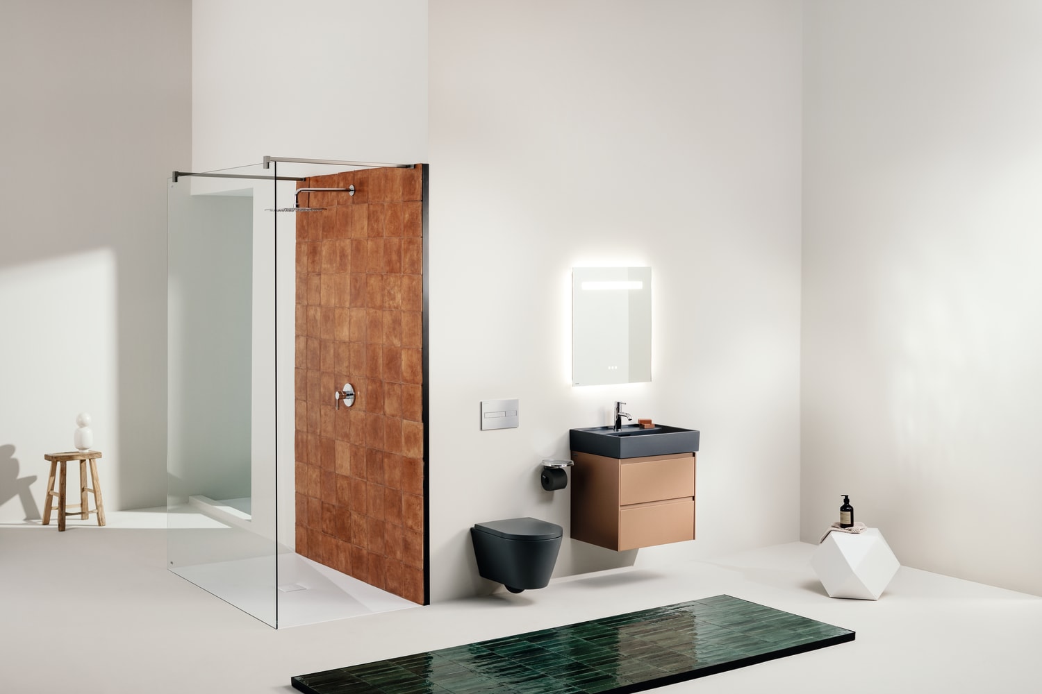 Kartell LAUFEN black wall-hung toilet installed beside a floating vanity in a contemporary bathroom